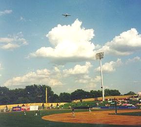 Photo of plane  taking off over field